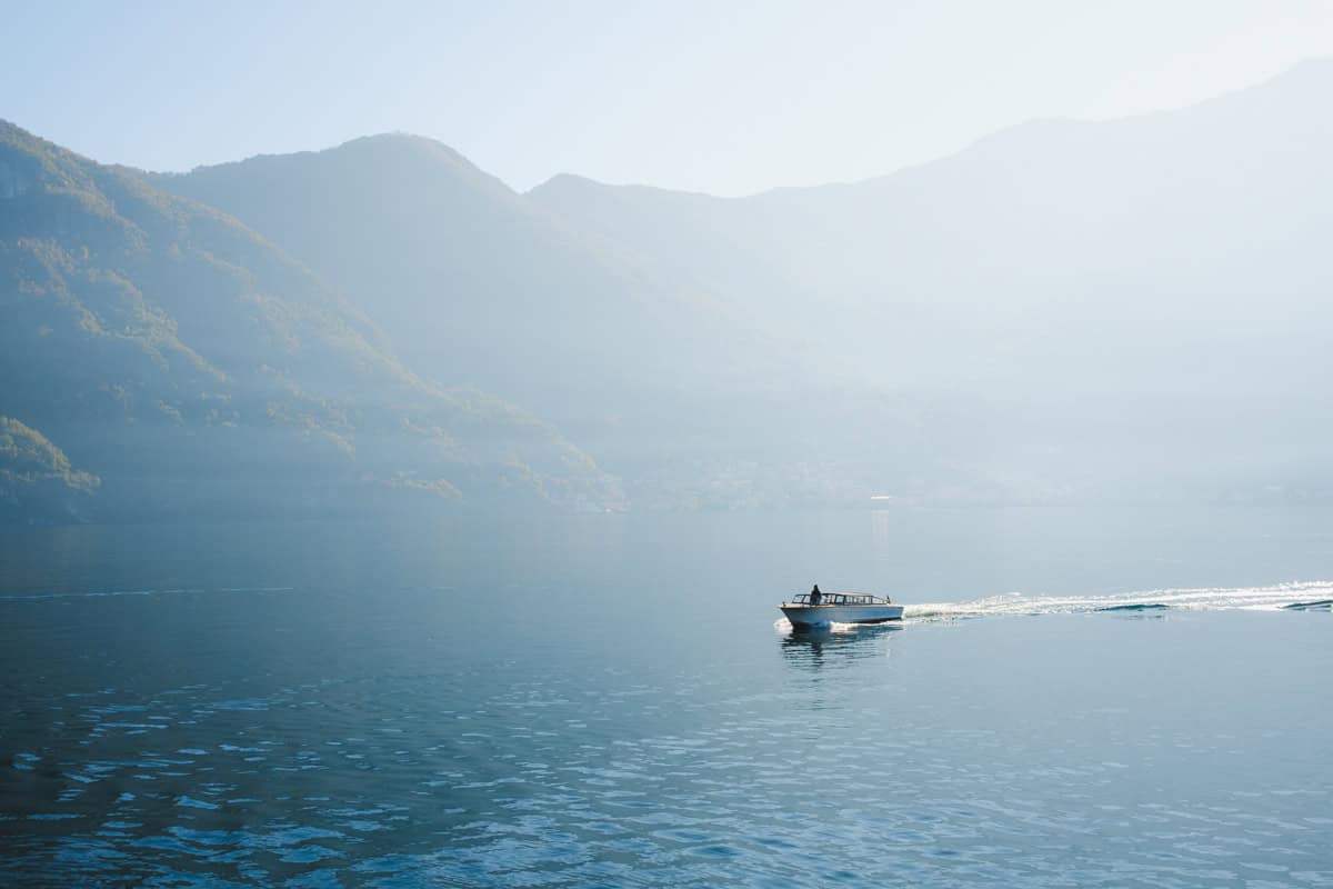 A small boat cruising lake como