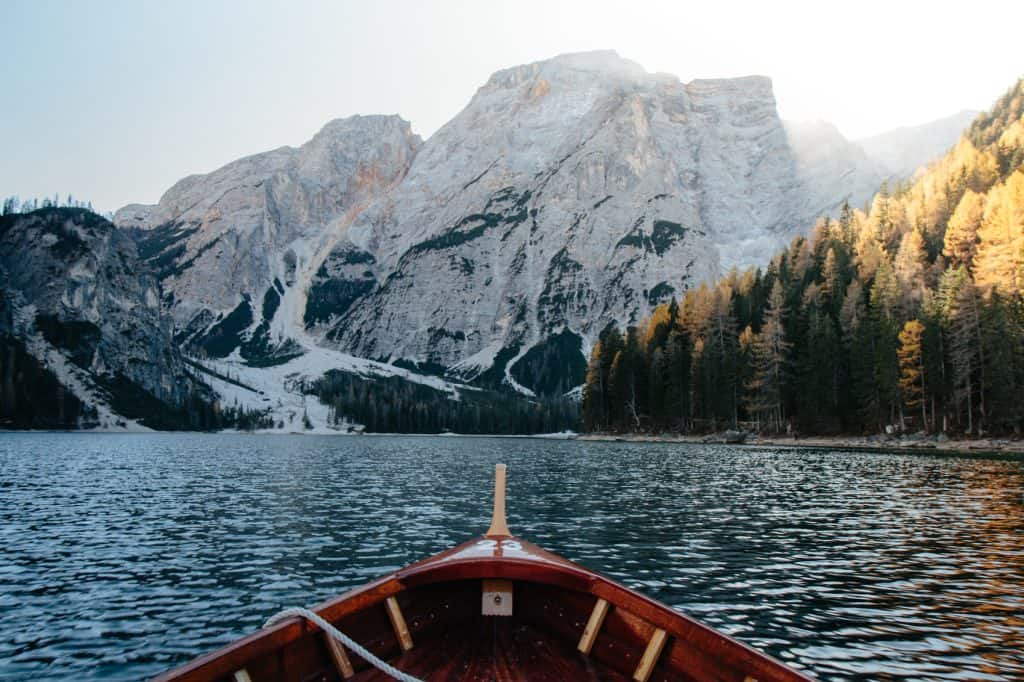 Lake Braies photographed from a wooden boat in the center of the lake