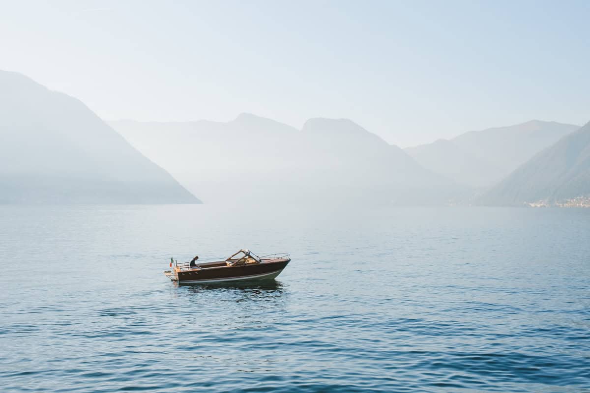 A wooden boat on Lake Como doing a private tour